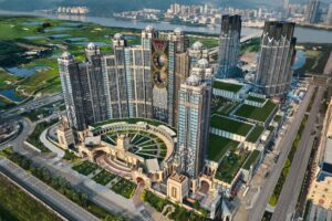 melco international expects to record impairment of up to us$128.6m